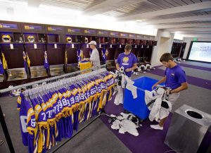 Row of Blue Football T-shirts with Players 