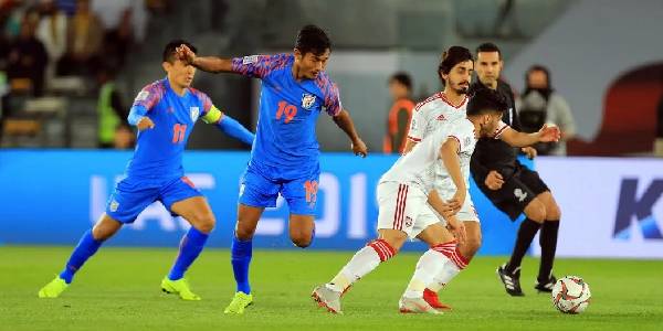 Image of Football Players While Playing in Football Match