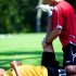 Experiencing Some Relaxing Massage Therapy By a Player During Practice Session in the Ground.